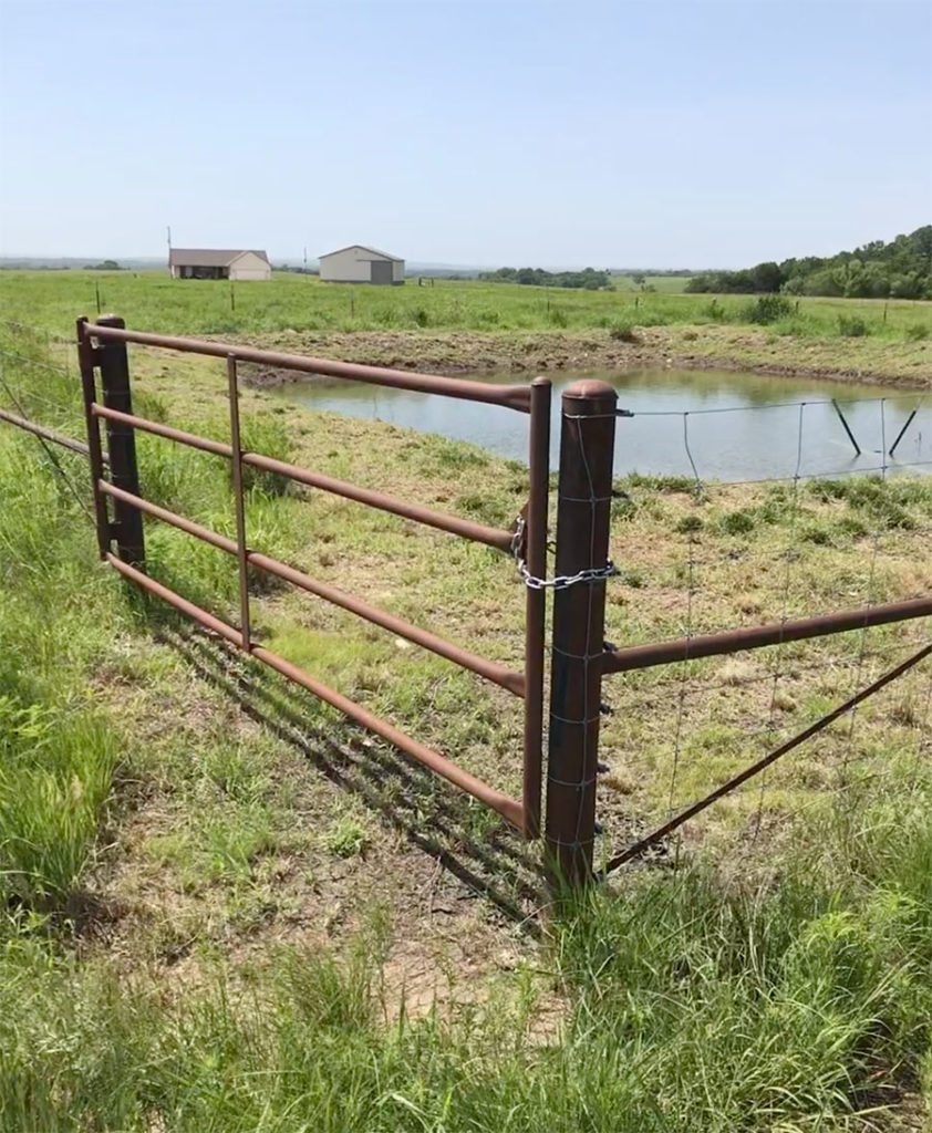 Sewage lagoon fence and gate